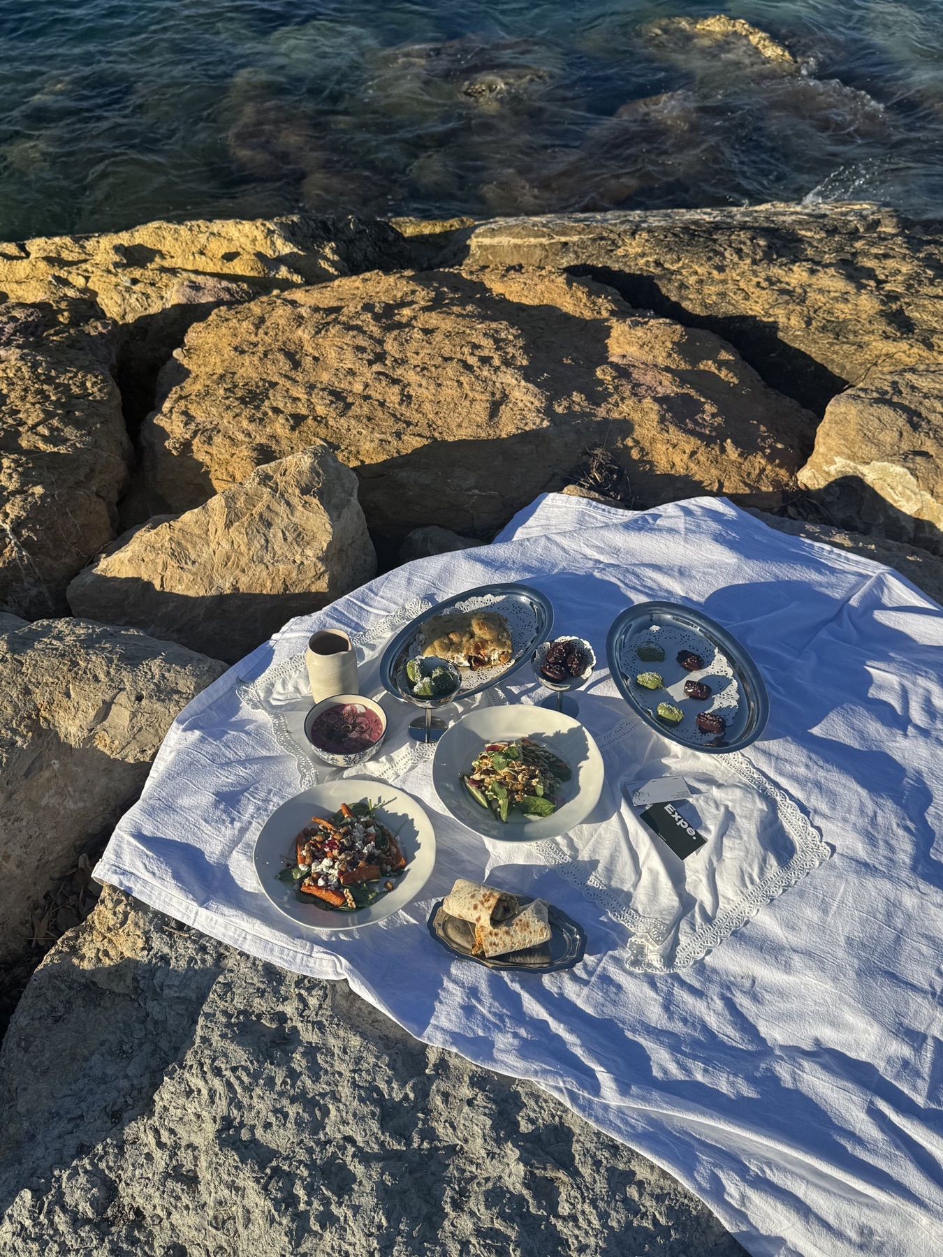 Luxury picnic on the rocks by the sea on the French Riviera