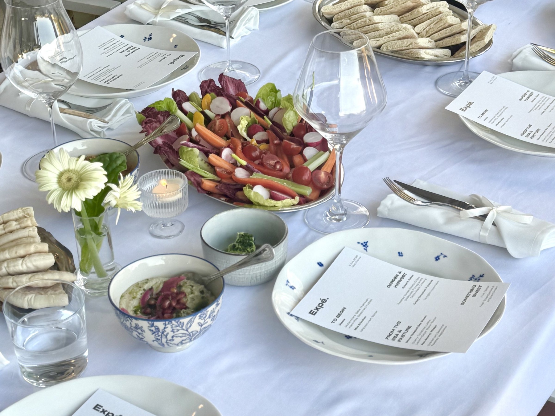 Sharing table with mezze and menus for private dining