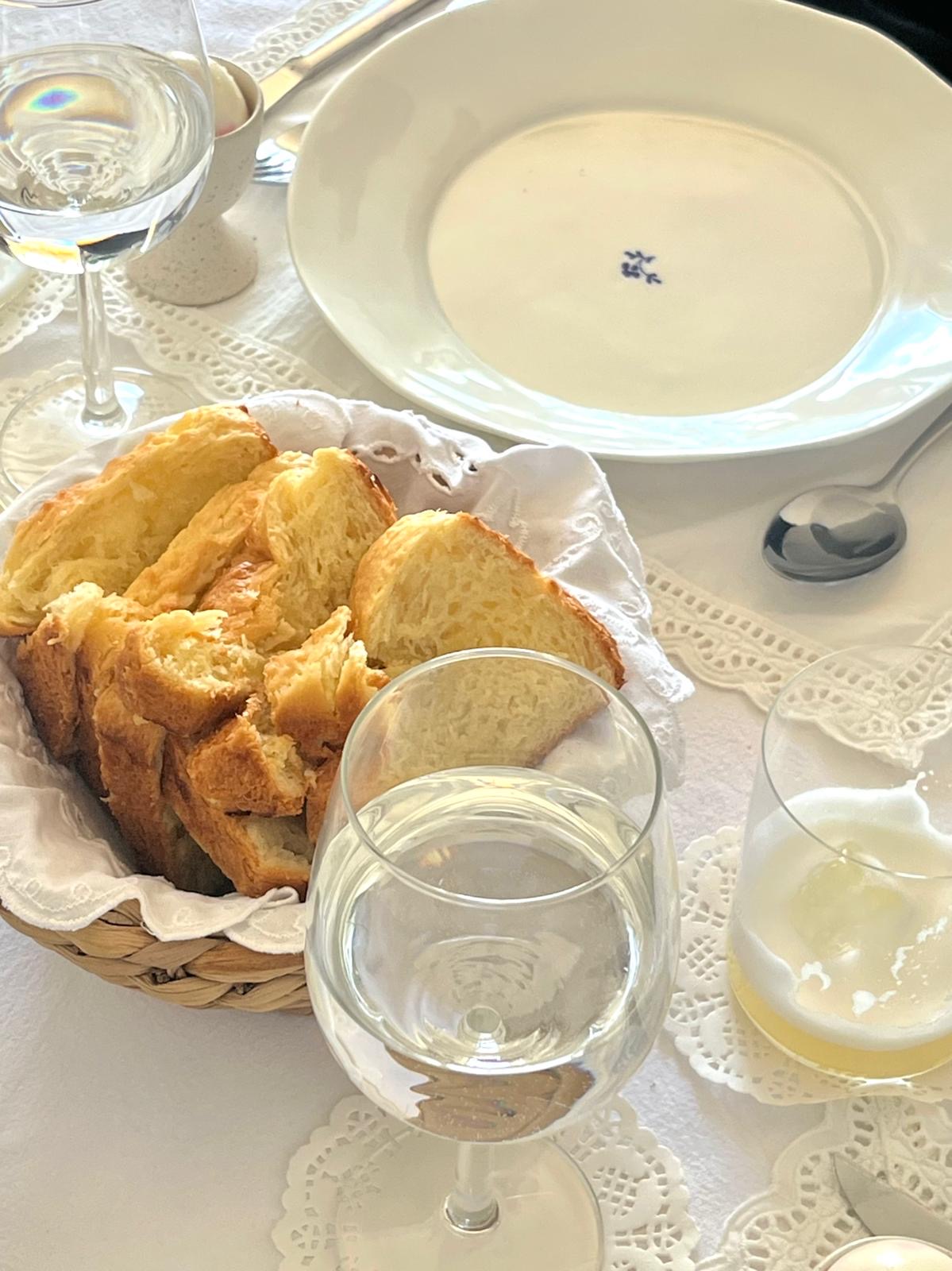 Fresh brioche and table setting prepared for a private dinner