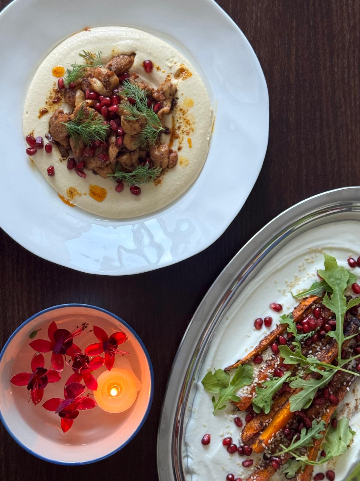 Chicken with hummus, roasted vegetables and pomegranate
