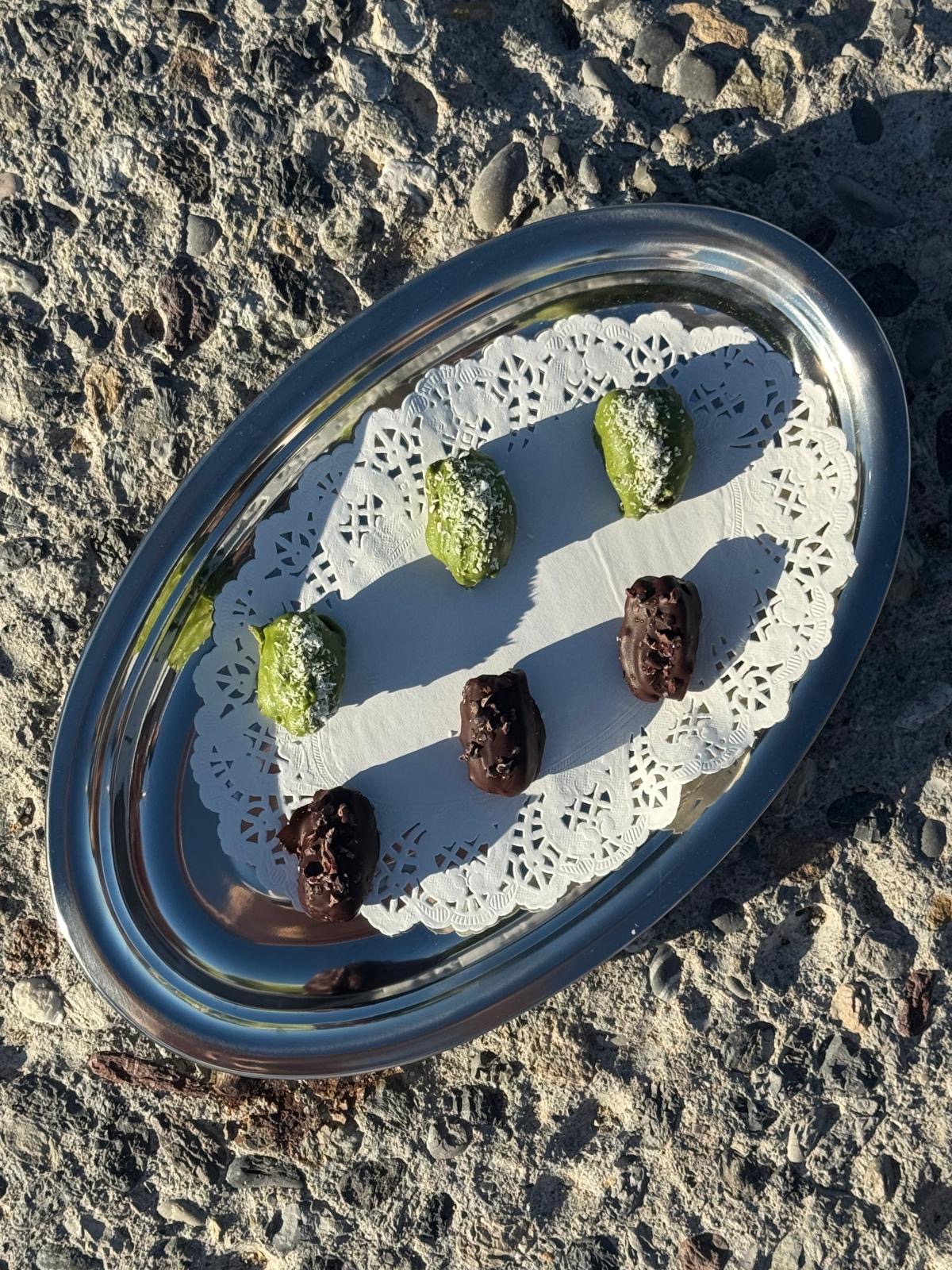 Chocolate and pistachio petit fours on a serving platter