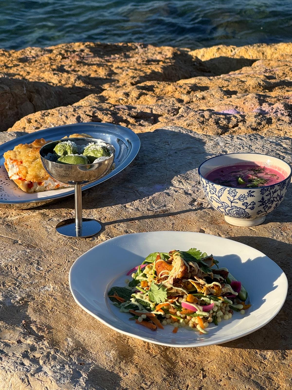 Private dining dishes served beside the Mediterranean
